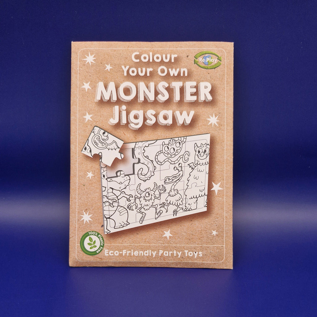 Monster jigsaw puzzle on a blue background.