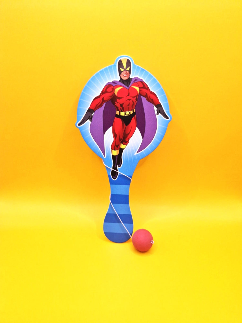 Superhero character on a paddle with a ball against a yellow background