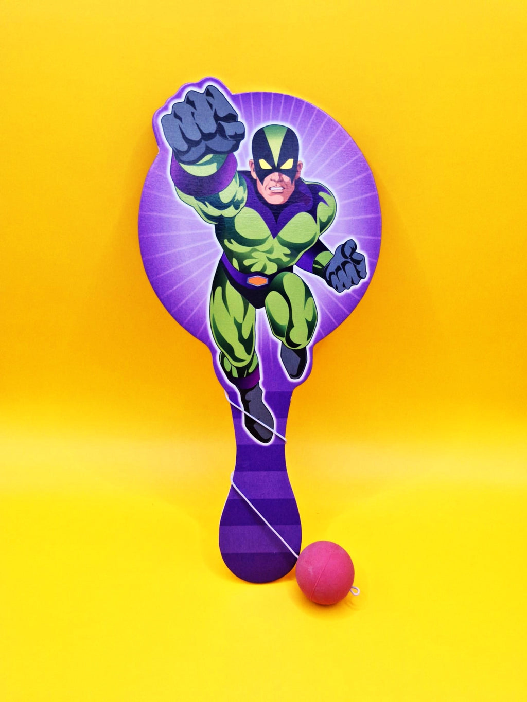 Superhero-themed paddle with a pink ball on a yellow background