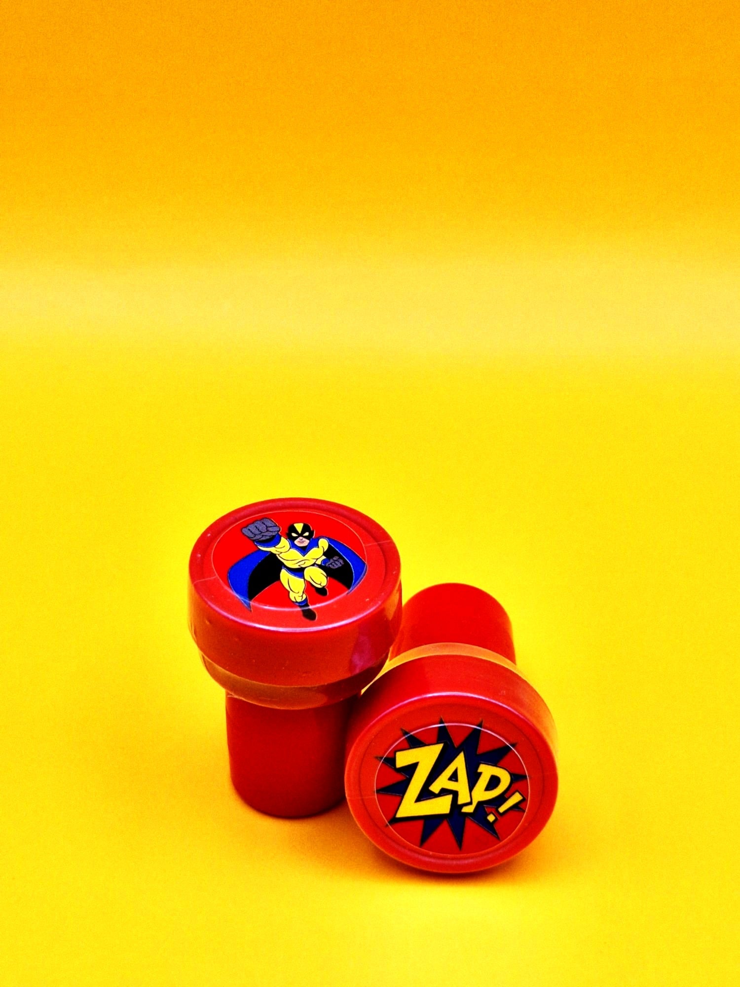 Red stamp with superhero design on a yellow background